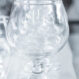 Many empty glasses in a line Many empty glasses in a line - selective focus point and lighting filter